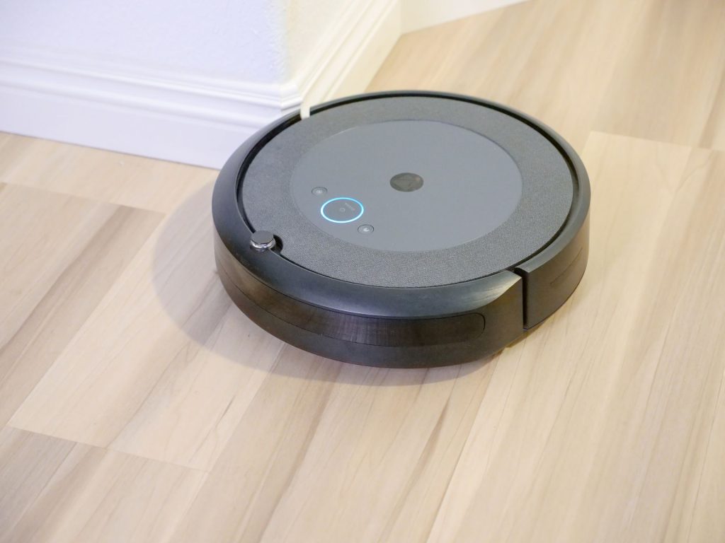 Robot vacuum cleaner running on a hardwood floor