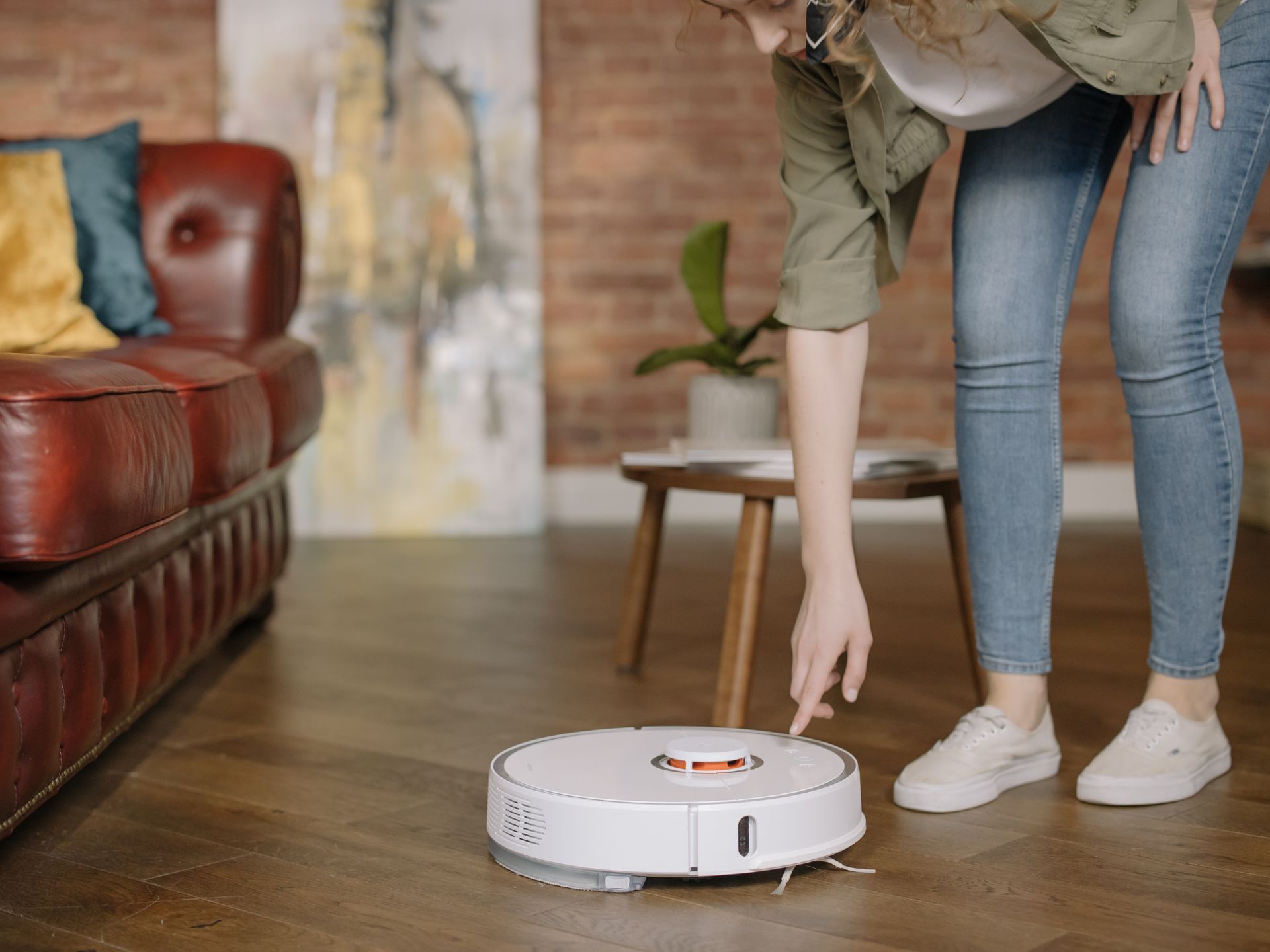 Robot vacuum cleaning pet hair on a living room floor