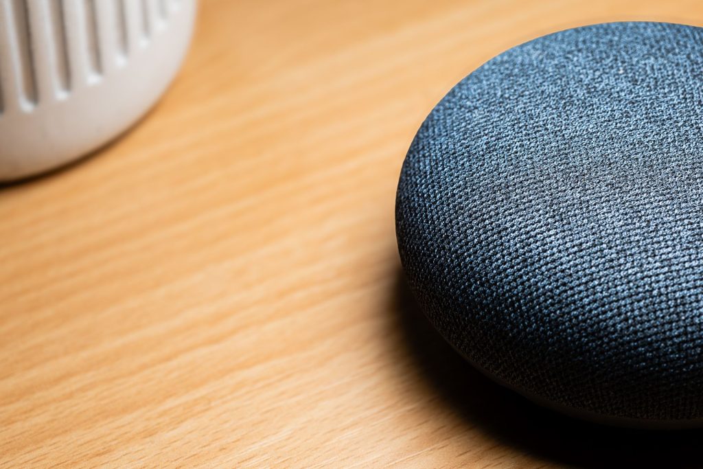 Close-up of a smart speaker on a wooden table